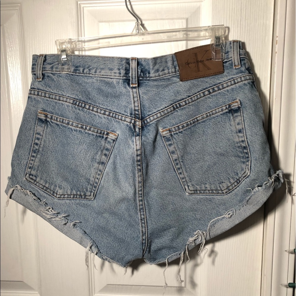 VINTAGE CALVIN KLEIN DISTRESSED JEAN SHORTS